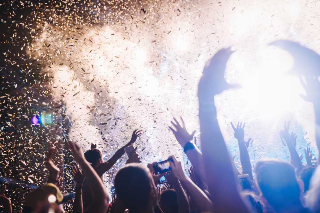 Portrait of happy crowd enjoying at music festival